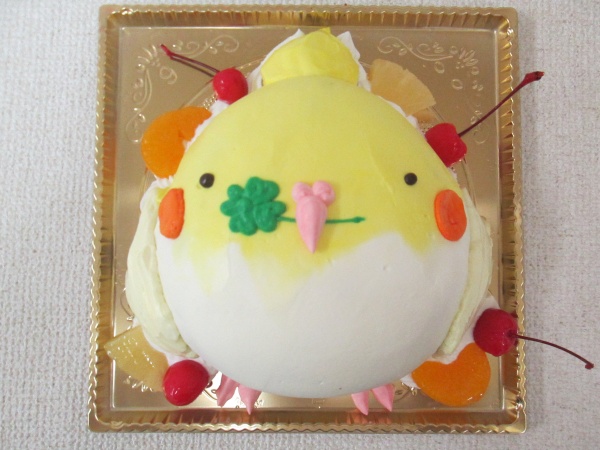 通販ケーキで クローバーをくわえた鳥のインコを立体形ケーキで 大阪市東住吉区 パティスリーデコ
